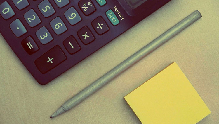 Calculator and pen calculating company car tax